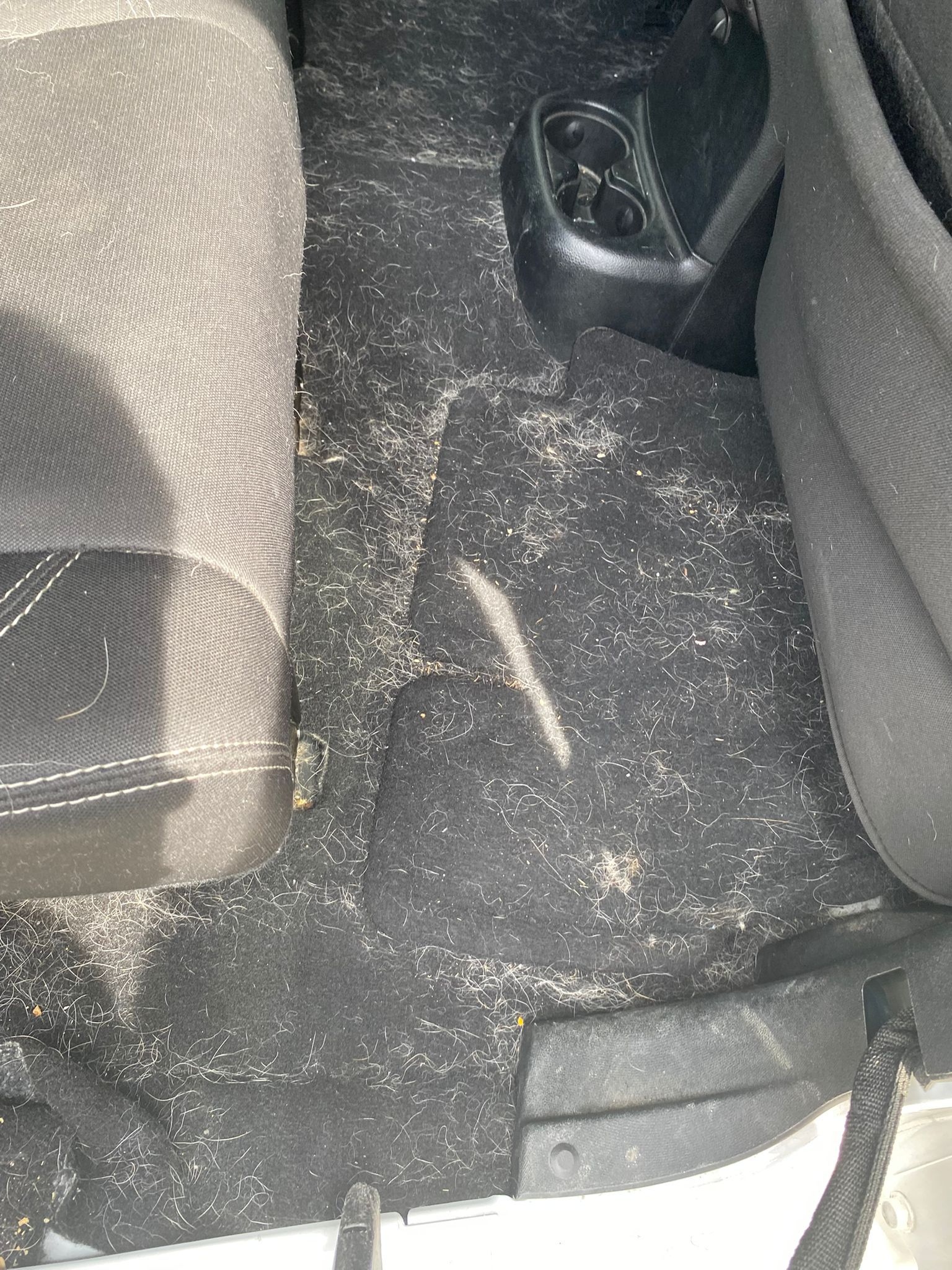 Before - dirty floor mats showing detailing transformation