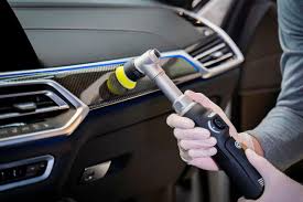 Orbital polisher with yellow pad for paint correction